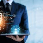 Businessman pushing AI button